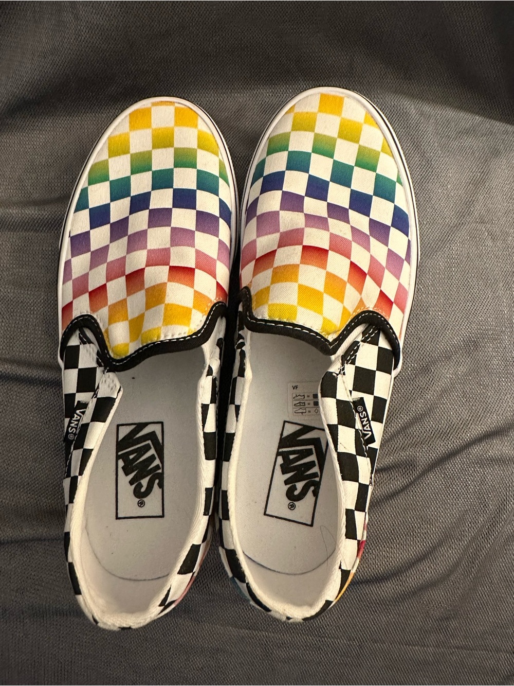 Vans Slip-On Sneakers with Rainbow Checkerboard and Black/White Trim